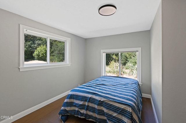 7950 Flynn Creek Rd, Comptche, CA 95427 - bedroom featuring baseboards and wood finished floors