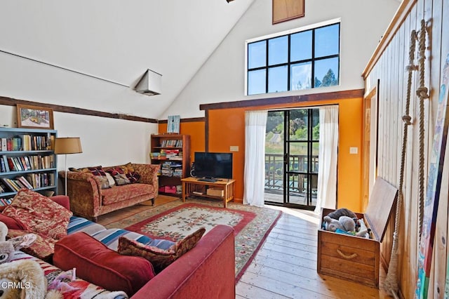 7950 Flynn Creek Rd, Comptche, CA 95427 - living area with high vaulted ceiling and hardwood / wood-style floors