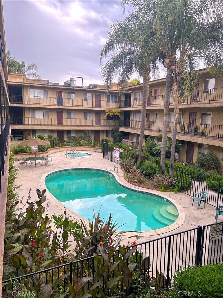 8505 Columbus Ave Unit 107, North Hills, CA 91343 - community pool with a patio