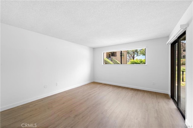 31291 E Nine Dr Unit 29F, Laguna Niguel, CA 92677 - empty room with wood finished floors and a textured ceiling