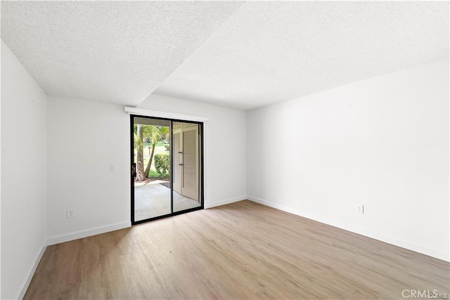 31291 E Nine Dr Unit 29F, Laguna Niguel, CA 92677 - unfurnished room featuring wood finished floors and a textured ceiling