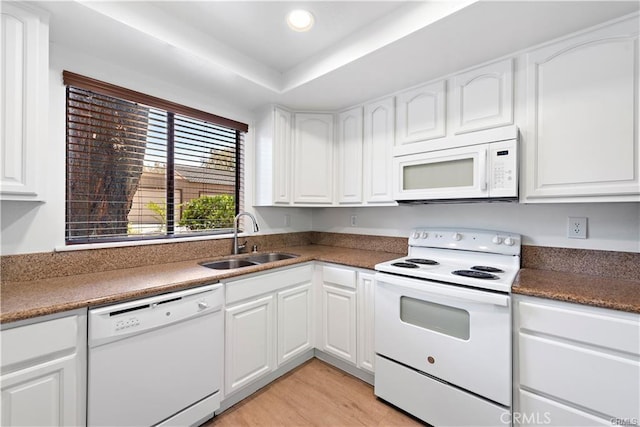 31291 E Nine Dr Unit 29F, Laguna Niguel, CA 92677 - kitchen featuring white appliances, white cabinetry, light wood finished floors, recessed lighting, and dark countertops