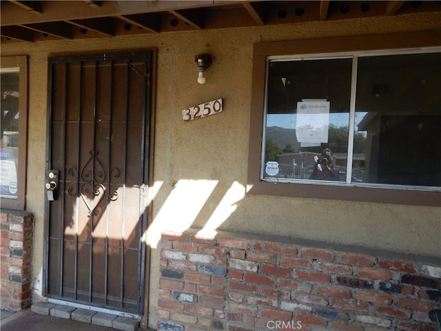 3250 Apple Ave, Jurupa Valley, CA 92509 - entrance to property featuring brick siding and stucco siding