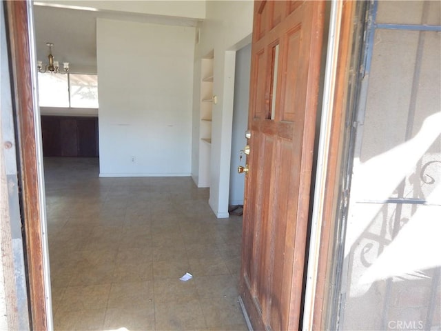 3250 Apple Ave, Jurupa Valley, CA 92509 - corridor featuring a chandelier and tile patterned floors
