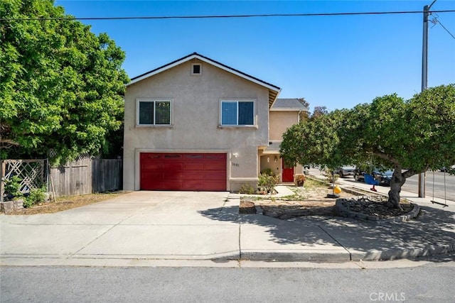 1681 Ocean St, Oceano, CA 93445 - view of front of home featuring stucco siding, driveway, and a garage