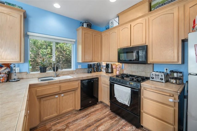 1681 Ocean St, Oceano, CA 93445 - kitchen with black appliances, light brown cabinets, tile counters, backsplash, and recessed lighting
