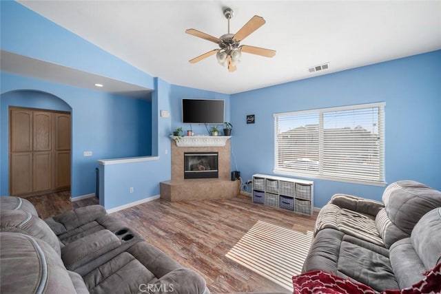 1681 Ocean St, Oceano, CA 93445 - living room with vaulted ceiling, ceiling fan, wood finished floors, and a high end fireplace