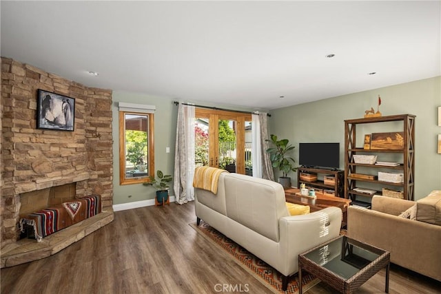 24 Spicewood Way, Irvine, CA 92612 - living area with wood finished floors and a fireplace