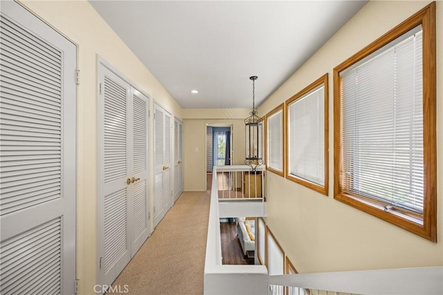 24 Spicewood Way, Irvine, CA 92612 - hallway with carpet, recessed lighting, and an upstairs landing