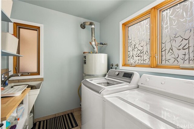 24 Spicewood Way, Irvine, CA 92612 - laundry area with electric water heater, washing machine and clothes dryer, cabinet space, and tile patterned floors