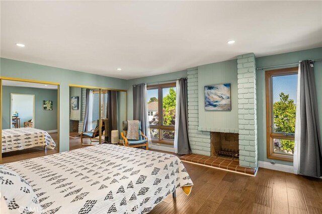 24 Spicewood Way, Irvine, CA 92612 - bedroom with wood finished floors, recessed lighting, and a fireplace