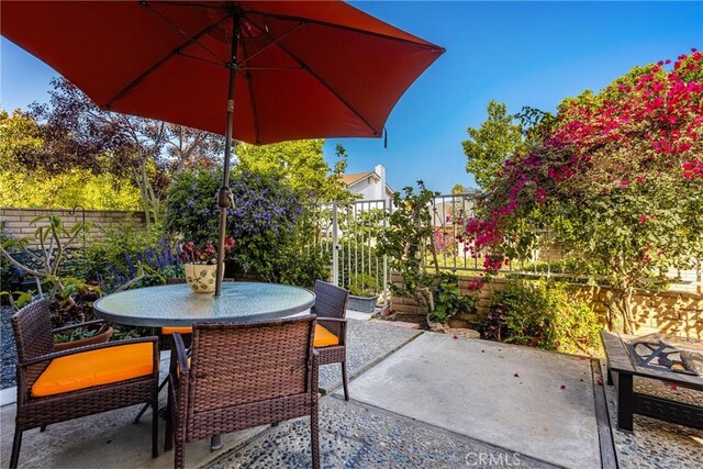 24 Spicewood Way, Irvine, CA 92612 - fenced backyard with outdoor dining area and a patio
