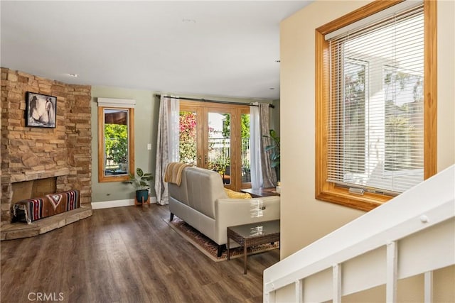 24 Spicewood Way, Irvine, CA 92612 - living room with plenty of natural light, wood finished floors, and a fireplace