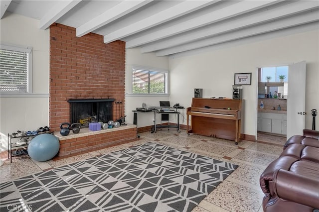 9513 Rex Rd, Pico Rivera, CA 90660 - living area featuring a fireplace, beam ceiling, and inlaid floor details