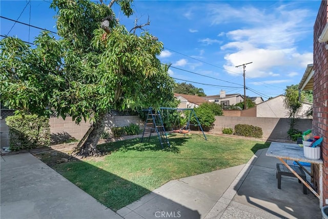 9513 Rex Rd, Pico Rivera, CA 90660 - fenced backyard with a playground and a patio