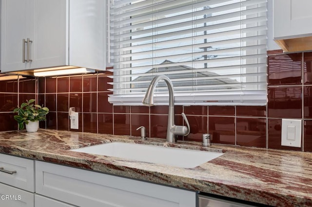 324 N J St, Oxnard, CA 93030 - kitchen view of backsplash, stone counters, and white cabinetry