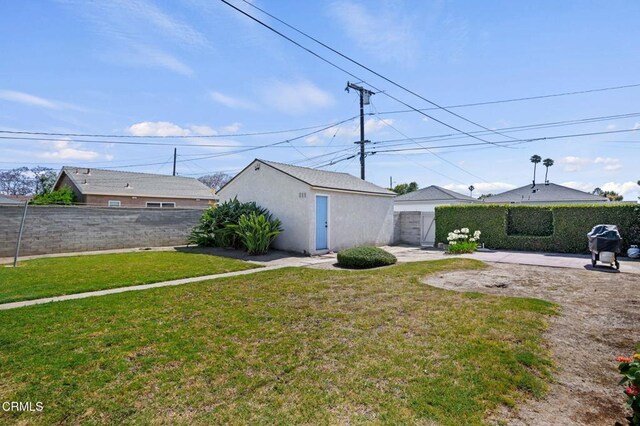 324 N J St, Oxnard, CA 93030 - fenced backyard featuring a patio and an outbuilding