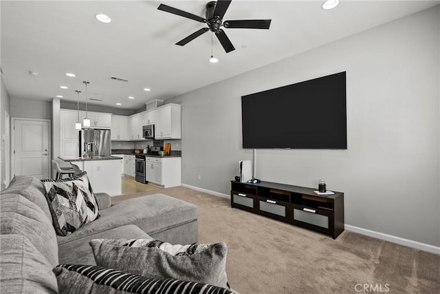 2894 E Via Fiano, Ontario, CA 91764 - living area featuring a ceiling fan, light carpet, and recessed lighting