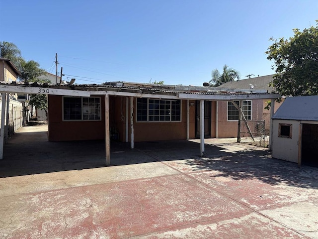 34850 Montgomery St, Chula Vista, CA 91911 - back of house featuring an outbuilding and stucco siding