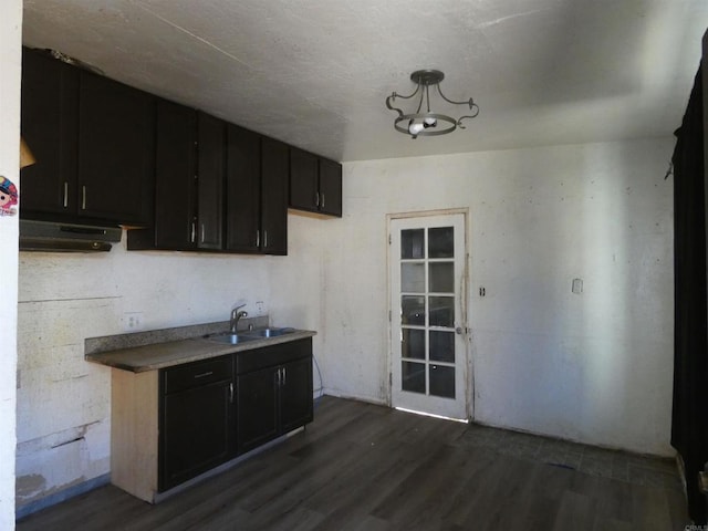34850 Montgomery St, Chula Vista, CA 91911 - kitchen featuring dark wood-style floors, a chandelier, and dark cabinetry
