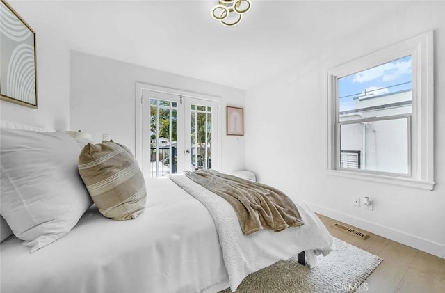 569 Lewis Ave, San Leandro, CA 94577 - bedroom with access to outside, wood finished floors, and french doors
