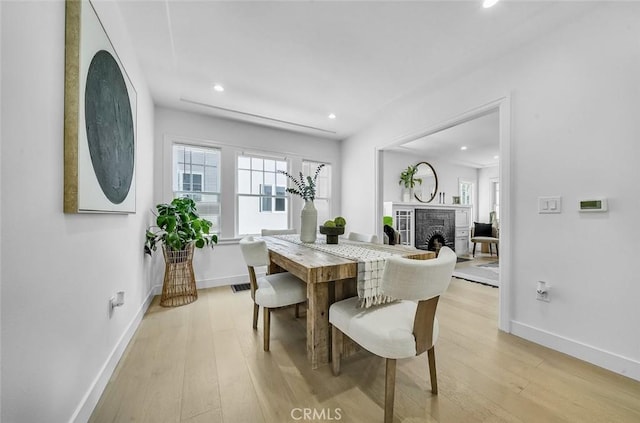 569 Lewis Ave, San Leandro, CA 94577 - dining room with light wood-style floors, recessed lighting, plenty of natural light, and a fireplace