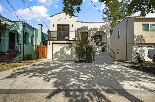 569 Lewis Ave, San Leandro, CA 94577 - view of front of house featuring stucco siding, driveway, and a garage
