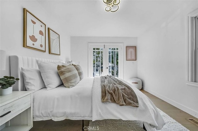 569 Lewis Ave, San Leandro, CA 94577 - bedroom with access to exterior, french doors, and wood finished floors