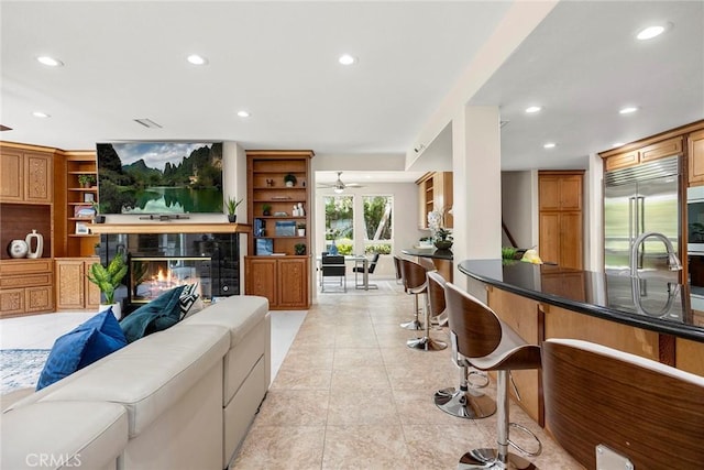 5210 Avenida De Kristine, Yorba Linda, CA 92887 - living area featuring recessed lighting, a tiled fireplace, ceiling fan, and light tile patterned flooring