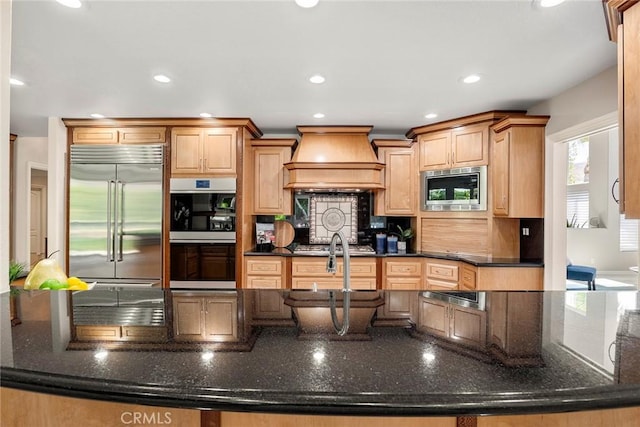 5210 Avenida De Kristine, Yorba Linda, CA 92887 - kitchen featuring built in appliances, custom range hood, recessed lighting, dark stone countertops, and tasteful backsplash