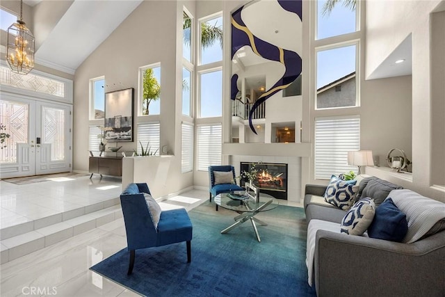 5210 Avenida De Kristine, Yorba Linda, CA 92887 - living area with high vaulted ceiling, healthy amount of natural light, a tile fireplace, french doors, and a chandelier