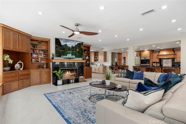 5210 Avenida De Kristine, Yorba Linda, CA 92887 - living area featuring ceiling fan, recessed lighting, a tiled fireplace, and light marble finish floors