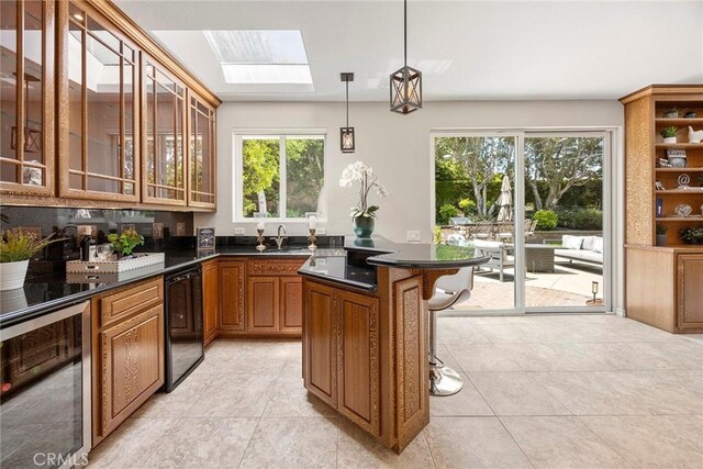 5210 Avenida De Kristine, Yorba Linda, CA 92887 - kitchen featuring wine cooler, a skylight, plenty of natural light, and a breakfast bar area