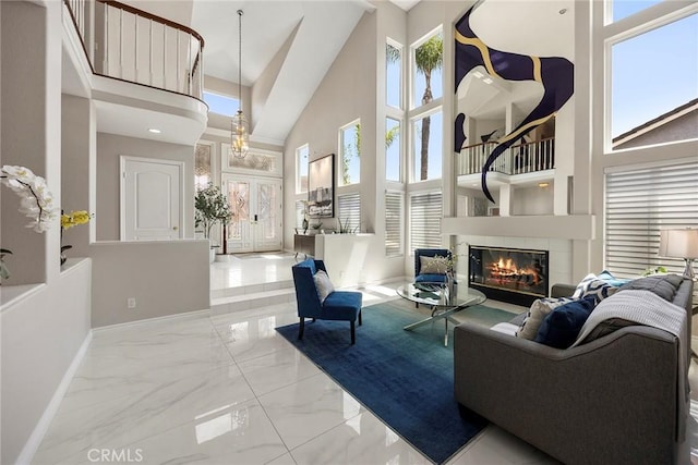 5210 Avenida De Kristine, Yorba Linda, CA 92887 - living room with a towering ceiling, plenty of natural light, marble finish floors, and a glass covered fireplace