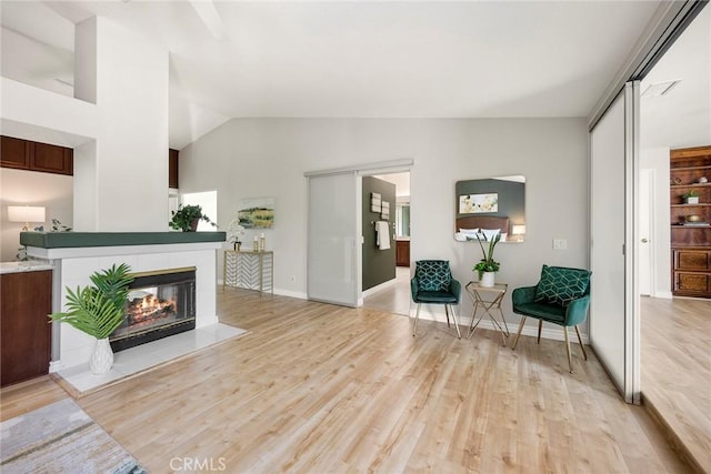 5210 Avenida De Kristine, Yorba Linda, CA 92887 - living area with light wood finished floors, lofted ceiling, and a tile fireplace