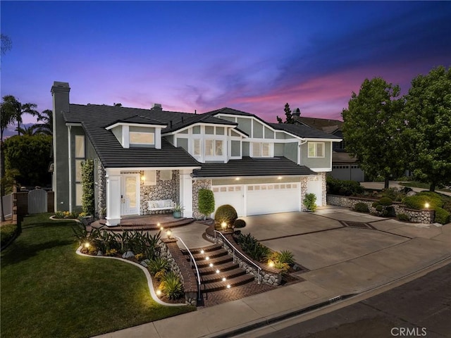 5210 Avenida De Kristine, Yorba Linda, CA 92887 - english style home with stone siding, a chimney, driveway, a front yard, and an attached garage