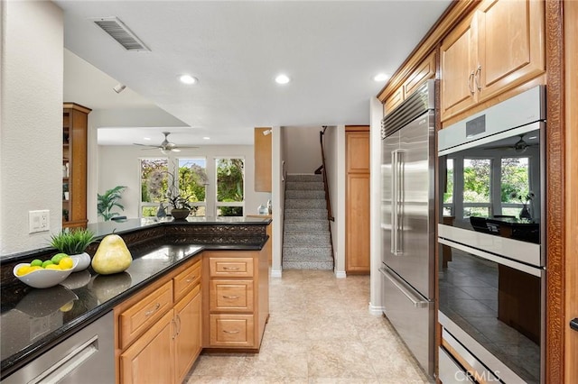 5210 Avenida De Kristine, Yorba Linda, CA 92887 - kitchen with appliances with stainless steel finishes, ceiling fan, recessed lighting, dark stone countertops, and light tile patterned floors