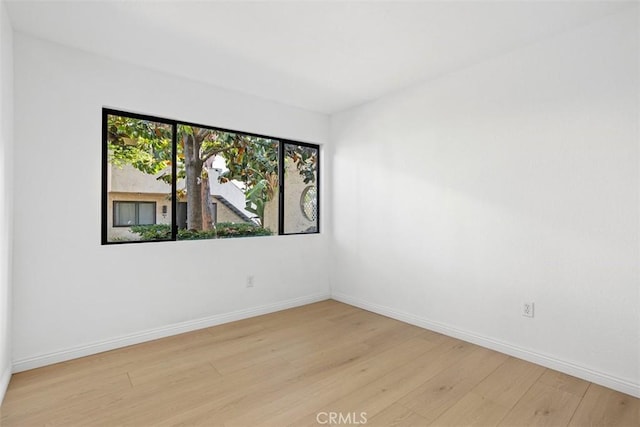 371 N Melrose Dr Unit A, Vista, CA 92083 - spare room with light wood-style flooring and baseboards