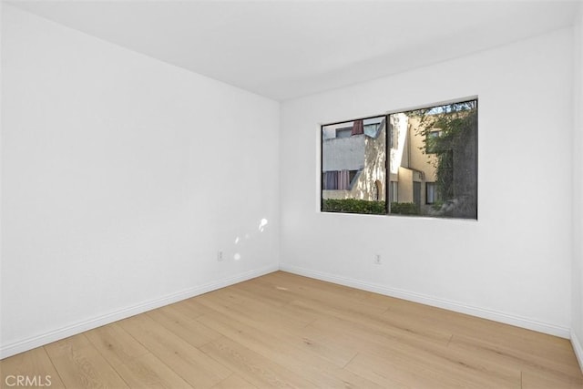 371 N Melrose Dr Unit A, Vista, CA 92083 - spare room with light wood-style floors and baseboards
