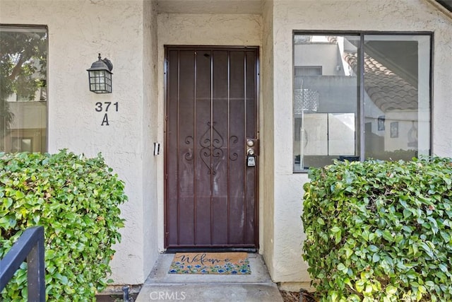 371 N Melrose Dr Unit A, Vista, CA 92083 - view of exterior entry featuring stucco siding