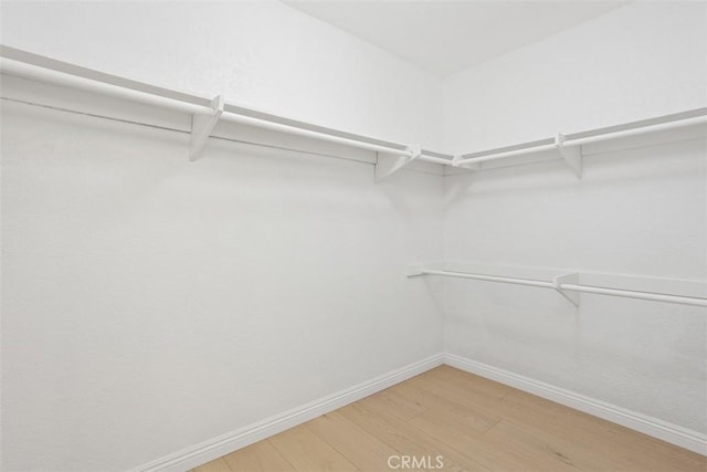 371 N Melrose Dr Unit A, Vista, CA 92083 - spacious closet with light wood-style flooring