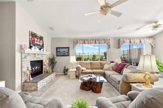 33818 Channel St, Temecula, CA 92592 - living room featuring ceiling fan, lofted ceiling, a stone fireplace, and light carpet