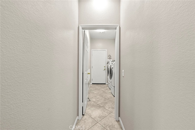 33818 Channel St, Temecula, CA 92592 - laundry area with independent washer and dryer, a textured wall, and light tile patterned flooring