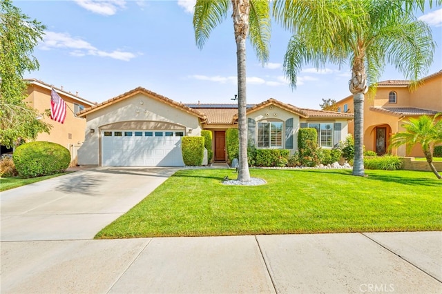 33818 Channel St, Temecula, CA 92592 - mediterranean / spanish-style house with an attached garage, stucco siding, driveway, solar panels, and a front yard