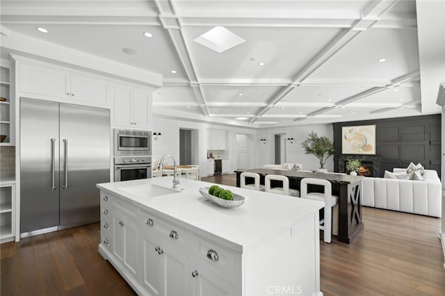 1456 Key Vw, Corona Del Mar, CA 92625 - kitchen featuring built in appliances, coffered ceiling, dark wood finished floors, white cabinetry, and recessed lighting