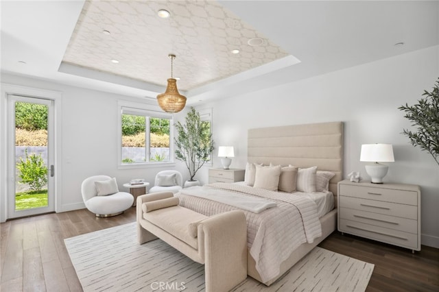 1456 Key Vw, Corona Del Mar, CA 92625 - bedroom featuring a tray ceiling, multiple windows, access to outside, and dark wood-style flooring