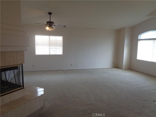 2425 Dixie St, Rosamond, CA 93560 - unfurnished living room with carpet, ceiling fan, and a fireplace