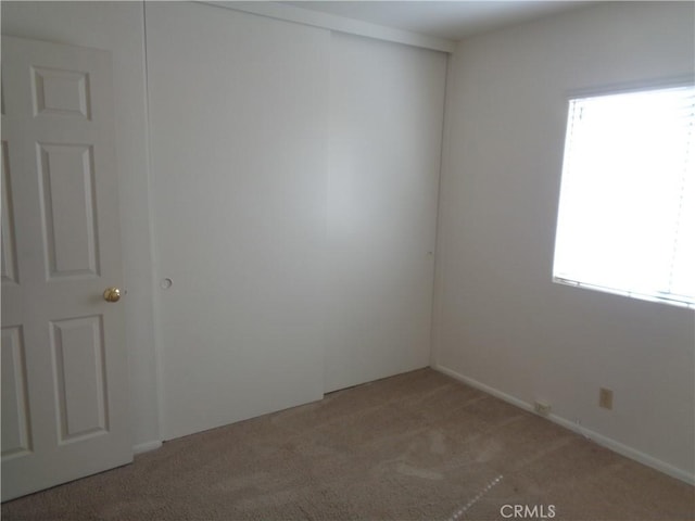 2425 Dixie St, Rosamond, CA 93560 - spare room with light colored carpet