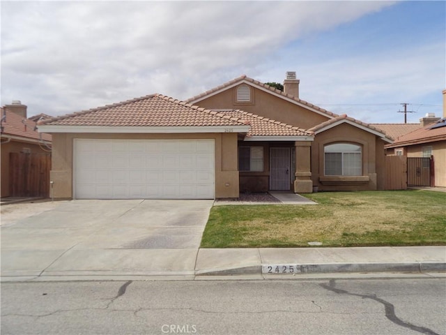 2425 Dixie St, Rosamond, CA 93560 - view of front facade with concrete driveway, an attached garage, stucco siding, a tiled roof, and a chimney
