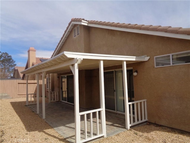 2425 Dixie St, Rosamond, CA 93560 - back of house featuring a patio, stucco siding, and a tile roof